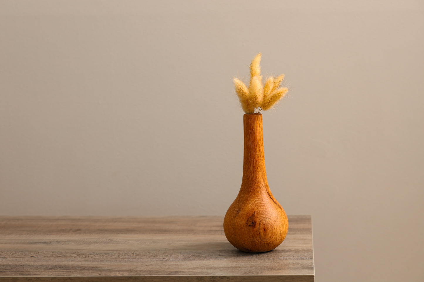 Wood turned teardrop style oak dry floral vase.