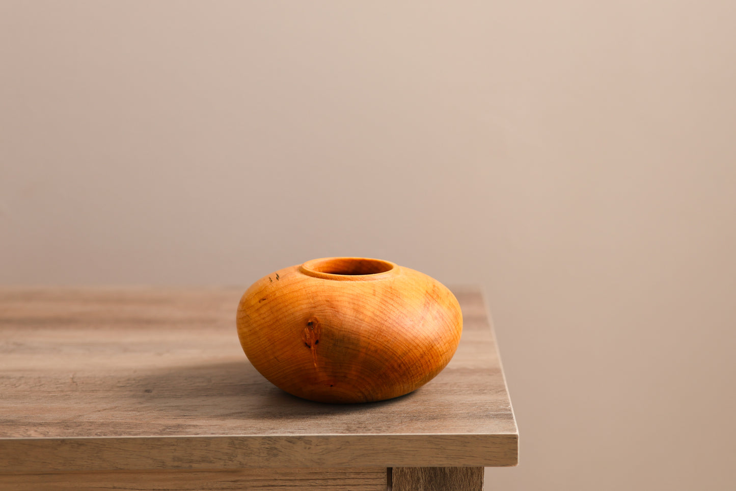 Wood turned small maple hollow form.
