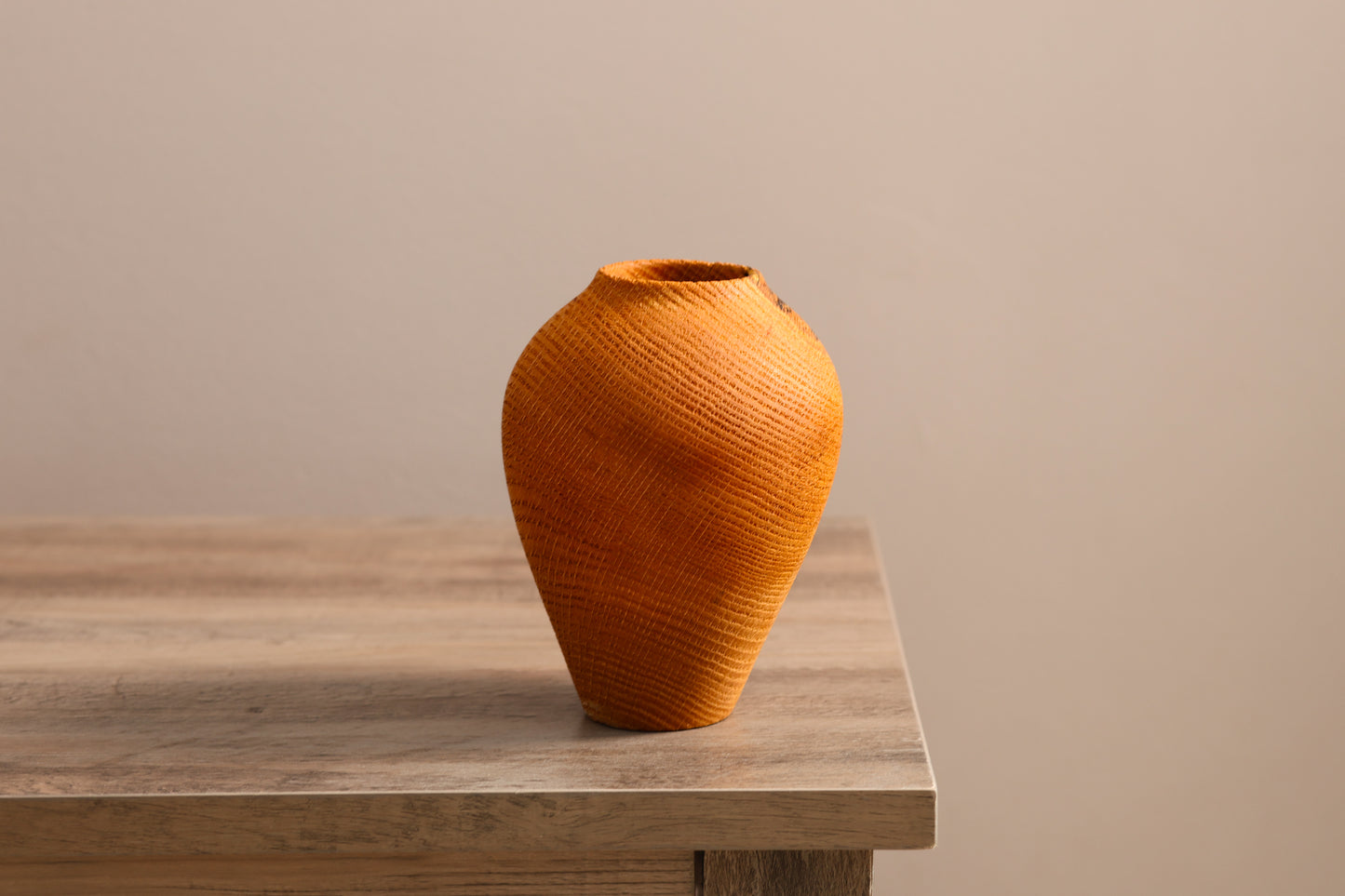 Wood turned textured oak hollow form vase.