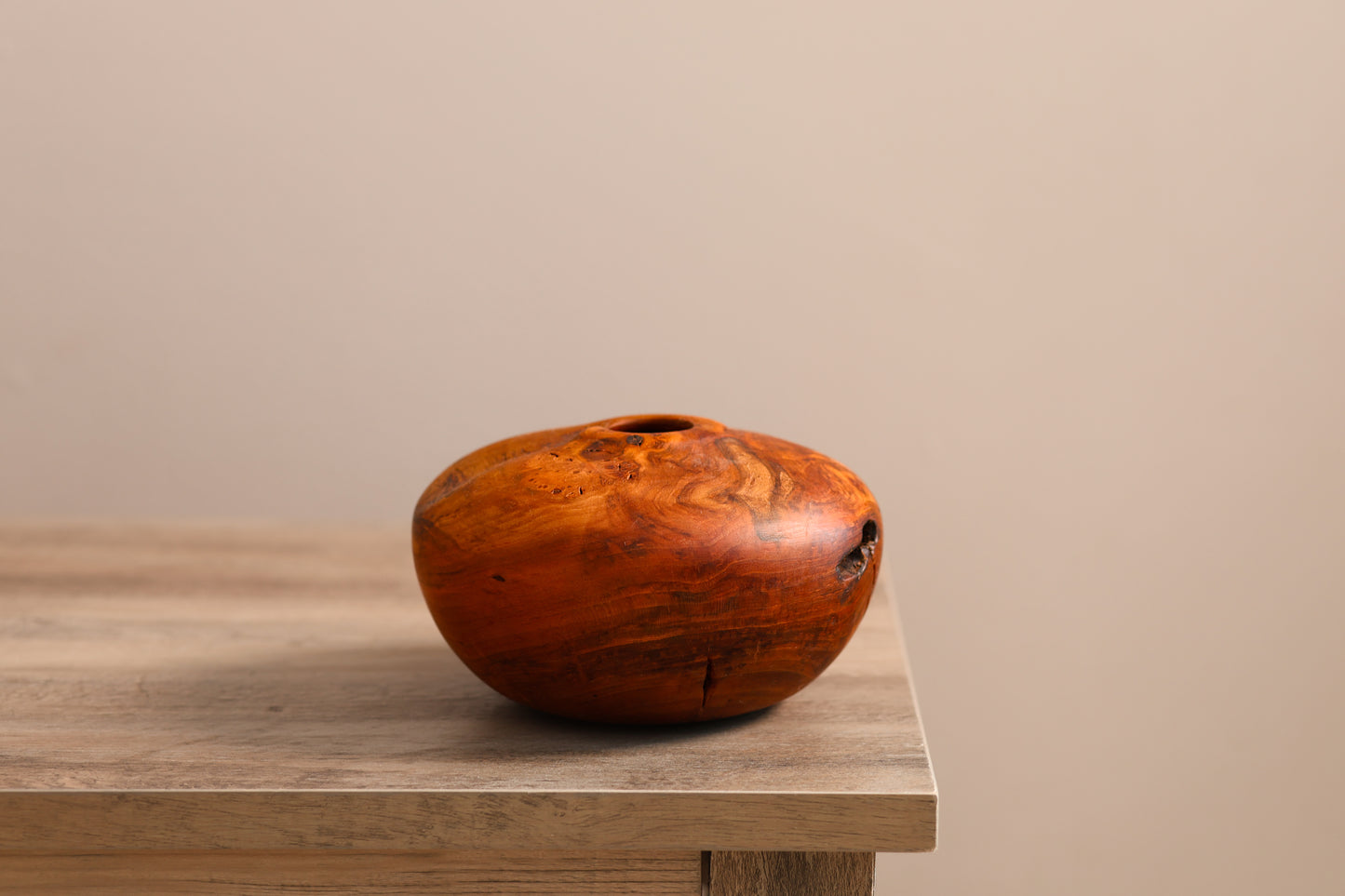 Wood turned cherry burl hollow form.